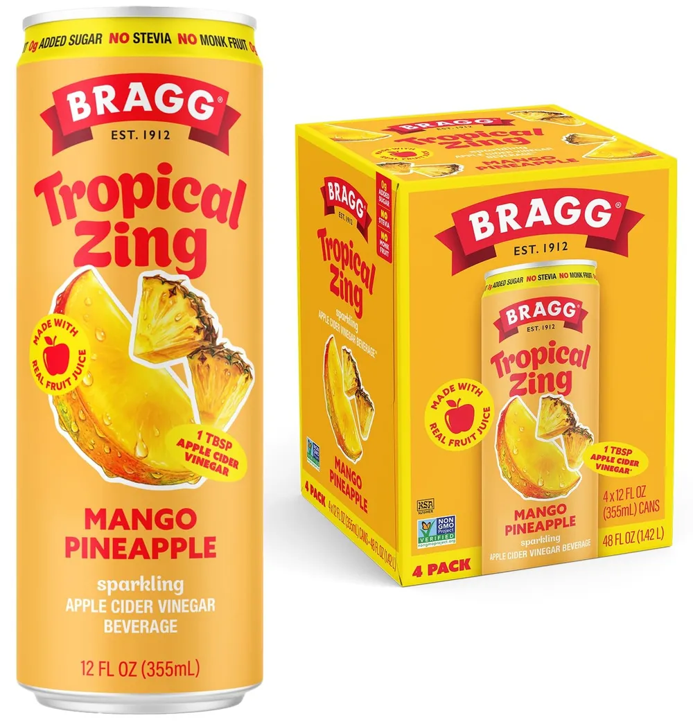 A yellow Bragg Tropical Zing Mango Pineapple sparkling apple cider vinegar can beside its matching four-pack carton