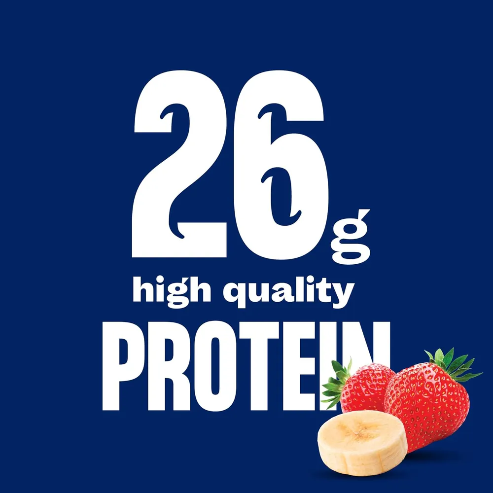 A square graphic on a dark blue background features large white “26g high quality PROTEIN” lettering, with illustrations of strawberries and a banana near the bottom right