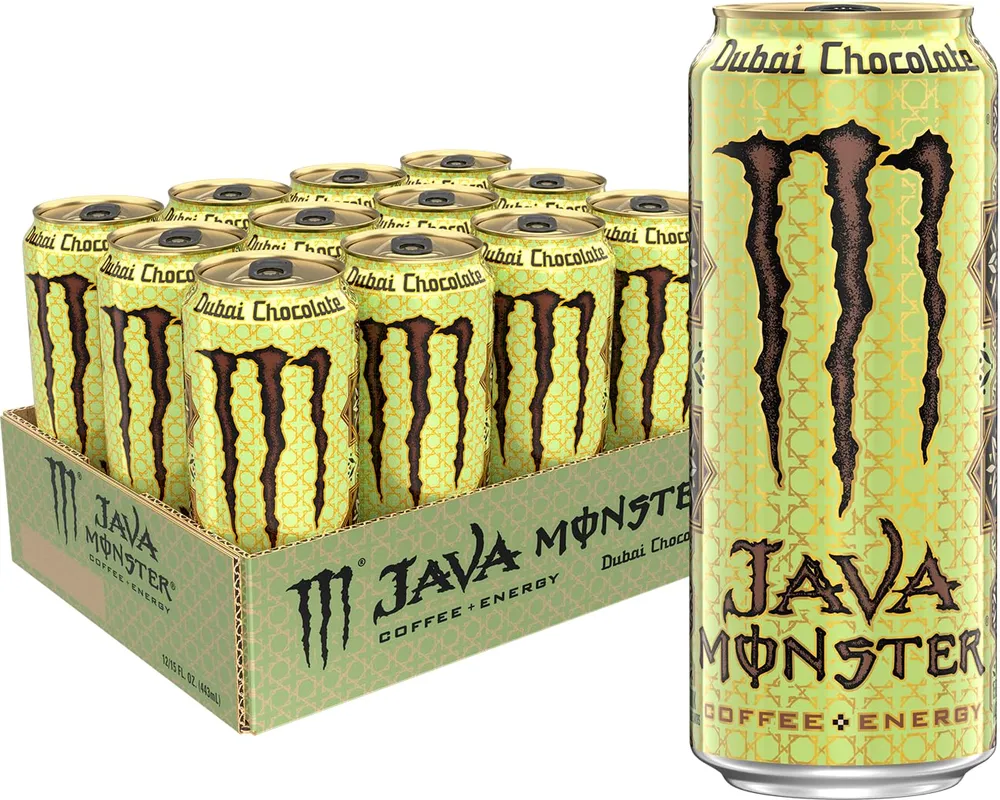 A pale yellow-green Java Monster can labeled “Dubai Chocolate” is shown enlarged beside a display tray holding multiple matching cans