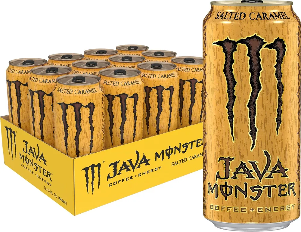 A gold Java Monster can stands beside a display tray filled with matching cans against a white background