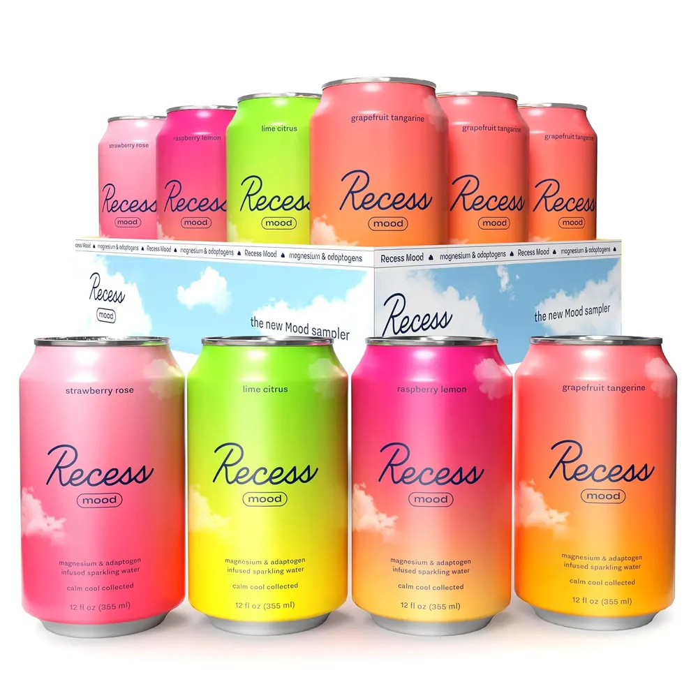 A variety pack of colorful Recess Mood cans is shown, with several flavors arranged in front of an open display box