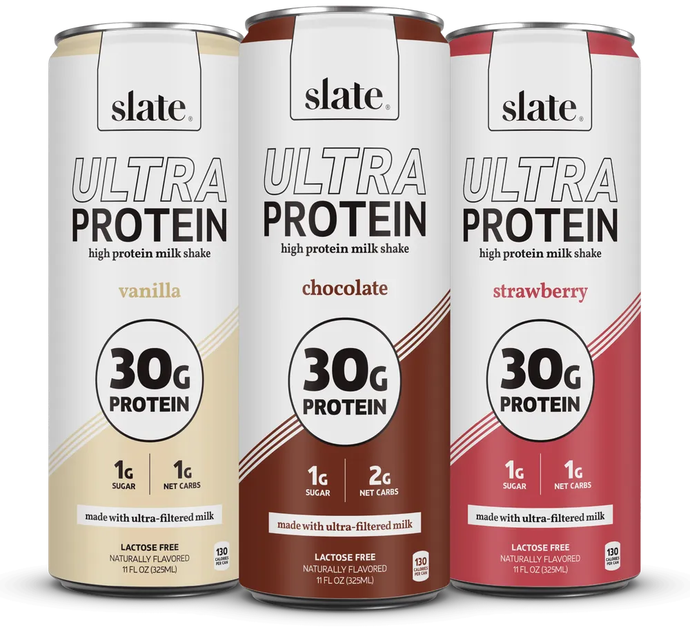 Three Slate Ultra Protein high-protein milk shake cans are shown side by side: vanilla, chocolate, and strawberry