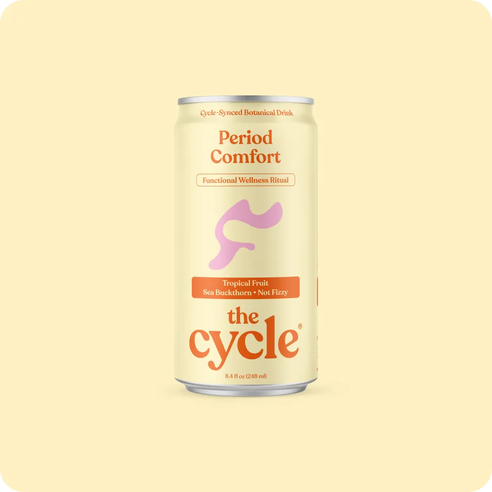 A single pale-yellow beverage can is shown upright against a light cream background